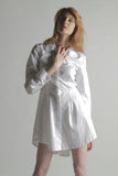 SOPHISTICATED YET SIMPLE. THIS TUNIC SHIRT DRESS IT FLARES OUT AT THE WAIST FOR A PEPLUM EFFECT